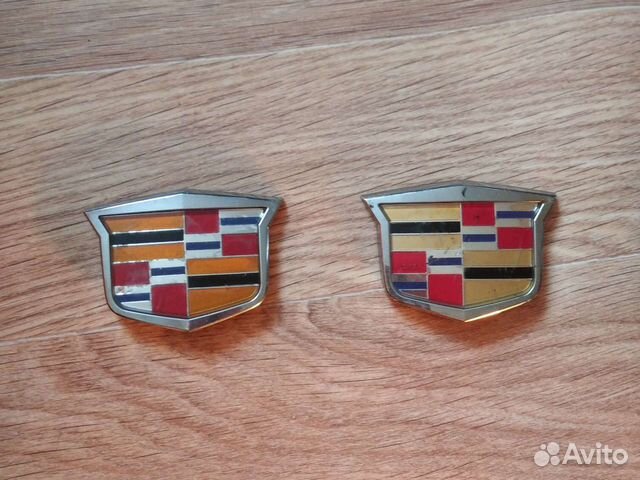 Эмблема cadillac
