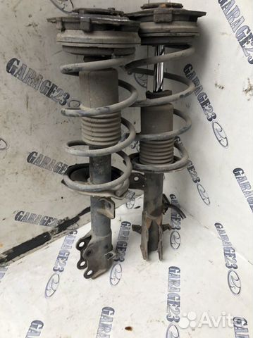 Стойка амортизатора передняя nissan tiida