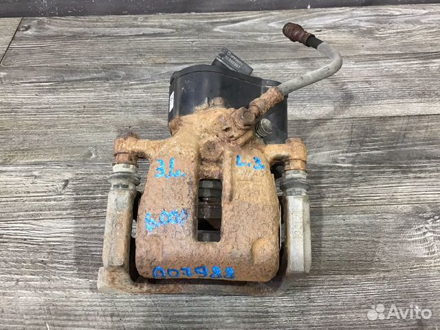 Суппорт тормозной задний левый Volkswagen Tiguan